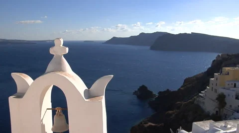 Bell tower with a cat sleeping in its shadow in the Santorini Island, Greece. 動画素材 61280678