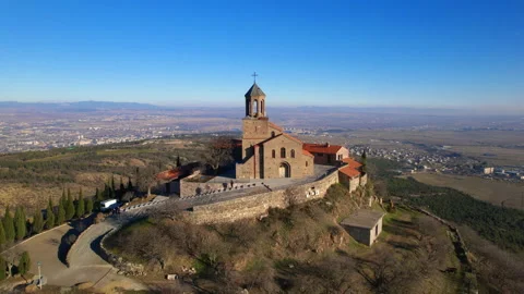 The bell tower with a cross on top of the dome of the church in the monastery of Stock Footage 233787603