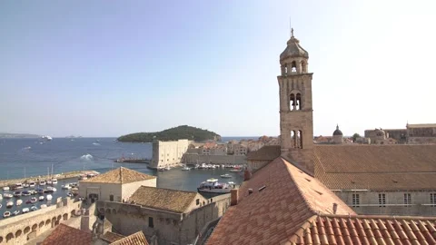 The bell tower of the Dominican monastery on the background of modern Dubrovnik Stock Footage 134875585