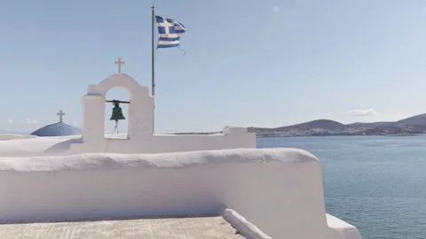 Bell Tower with Greek Flag Overlooking the Sea, Paros, Greece Vidéo 290129662