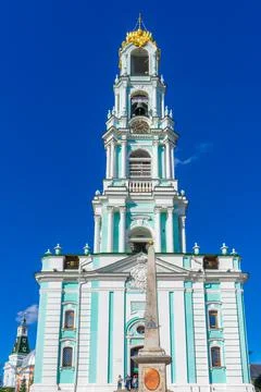 Bell tower of Holy-Trinity St. Sergius Lavra against blue sky. Sergiyev Posad Stock Photos
