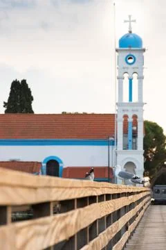 Bell tower of Saint Nicholas monastery in Porto Lagos, Xanthi, Greece. Seagul Stock Photos