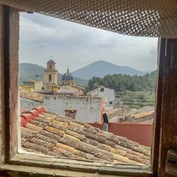 Bell tower seen through the window Stock Photos