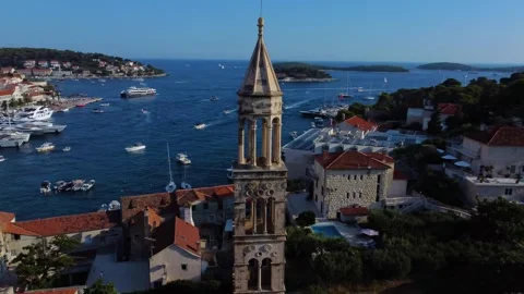 Bell tower of st. Mark's church overlooking hvar harbor in croatia Stock Footage 340381220