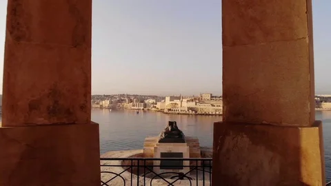 Bell Tower Sunrise in Malta with calm sea view Stock Footage