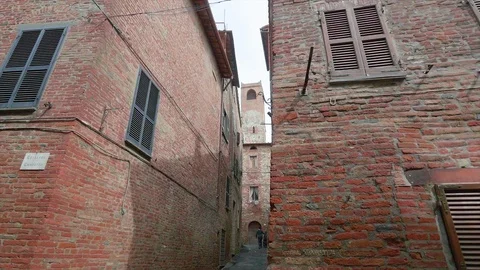 Bell tower through the buildings in Città Della Pieve, Perugia Stock Footage 112558334