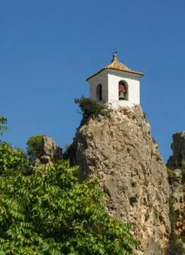 A Bell Tower at the top of a mountain Stock Photos