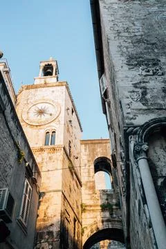 The bell tower under the clock at old town in Split, Croatia Photos