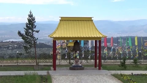 Bell under a canopy in the territory of the Buddhist temple Stock Footage 75561828