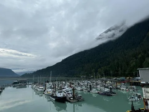 Bella Coola BC Bella Coola harbour marina beneath clouds Stock Photos