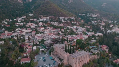 Bellapais Monastery aerial sunset view in Bellapais village, North Cyprus Stock Footage 235537982