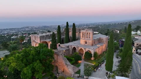 Bellapais Monastery aerial sunset view in Bellapais village, North Cyprus Stock Footage 235538201