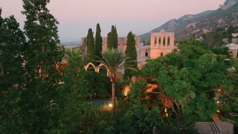Bellapais Monastery aerial sunset view in Bellapais village, North Cyprus Stock Footage 235538720