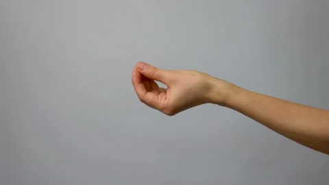 Bellissimo hand gesture on grey background with copy space Stock Footage 238355259