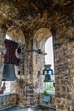 The bells are ringing in the stone bell tower of the romanesque Holy Mary Chu 스톡 사진