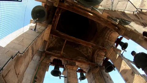 BELLS FROM A CATHEDRAL WITH PEOPLE Stock Footage 90132050