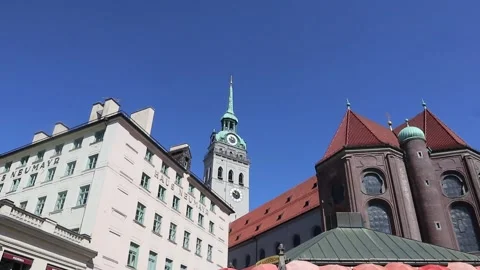Bells ring in the square in the center of Munich, Germany Stock Footage 310739494