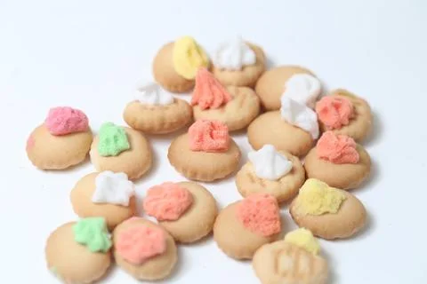 Belly button iced gem biscuits on white background Fotos de archivo