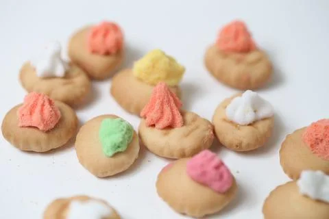 Belly button iced gem biscuits on white background Foto stock