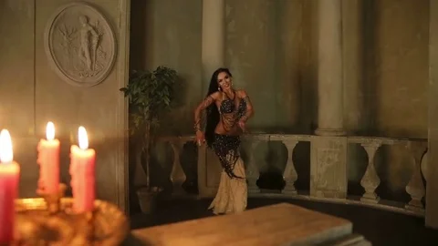 Bellydancer with candles and in beautiful clothes Stock Footage 80126892