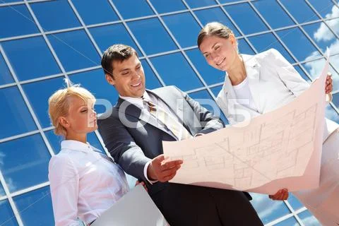 Below angle of successful partners planning work outside Stock Photos