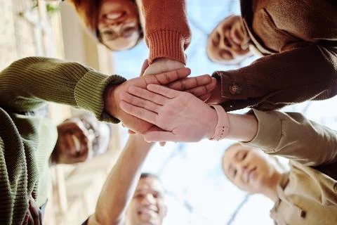Below, hands stack and group of students for motivation, support or education in 스톡 사진