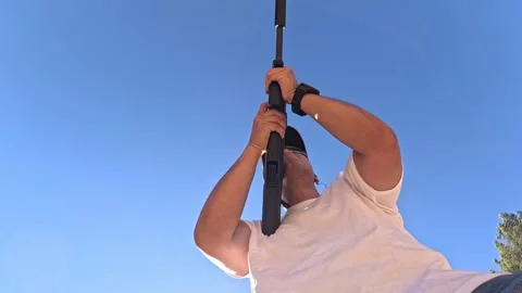 Below rifle view of brass shells ejecting from PS90 rifle as it is fired 库存影片 287465736