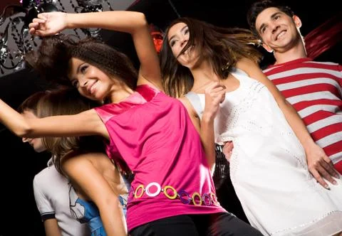 Below view of cheerful friends enjoying the party in the night club Stock Photos