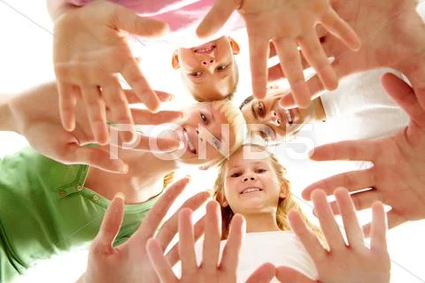 Below view of family members head by head and showing hands Stock Photos