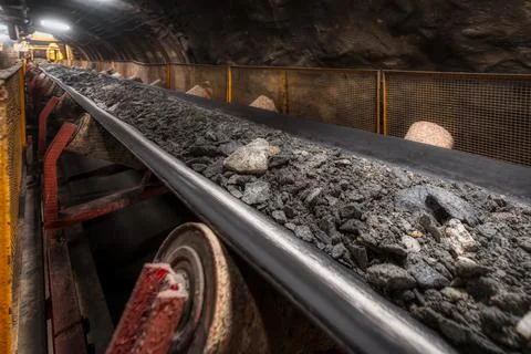 Belt conveyor with ore Underground mining Stock Photos