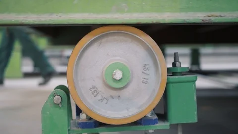 Belt conveyor roller support of grey colour rotates closeup Stock Footage 124892876