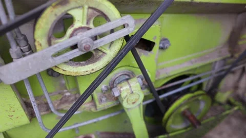 Belt Pulley In Mechanical Wheels Of A Rustic Tractor. Tilt-Down, Slow Stock Footage 170522960