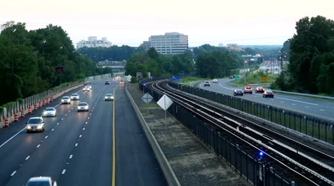 Beltway traffic train time-lapse dusk Video stock 66799531