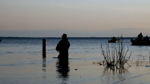 BEMIDJI, MN - 11 MAY 2019: Minnesota Fishing Opener. Wading fisherman Stock Footage 108281188