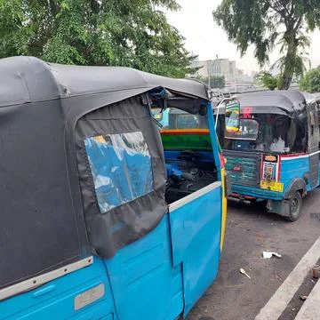 "bemo" queue, public transportation with three wheels waiting for passengers Stock Photos