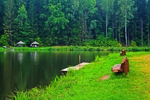 Bench against the backdrop of the lake Stock Photos