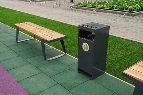 Bench and dustbin Stock Photos