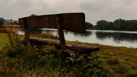 Bench and lake 4k slow motion Stock Footage 248844571