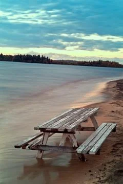 Bench and table sunk into the sand Stock Photos