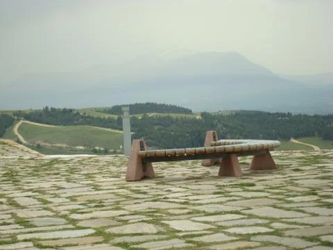 Bench on a background of mountains Stock Photos
