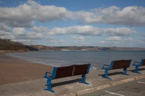 Bench by the beach Stock Photos
