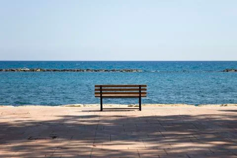 Bench on the beach Stock Photos