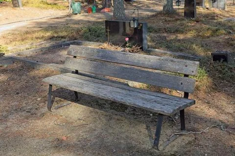 Bench in cemetery. Stock Photos