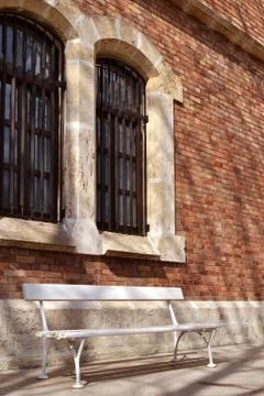 Bench on classic old building Stock Photos