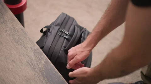 Bench Closeup White Commuter Securing Backpack Zipper, Urban Park Seating, Hands Stock Footage 324754324