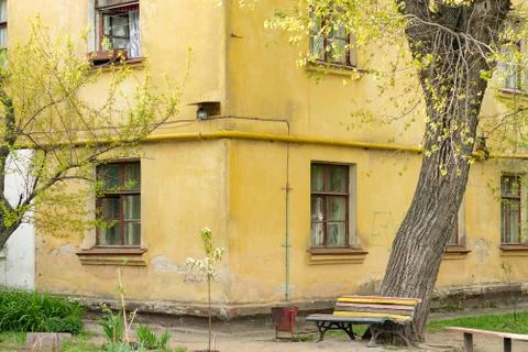 Bench on the corner of old building Stock Photos