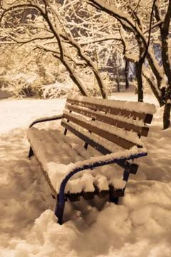 Bench covered in snow Stock Photos