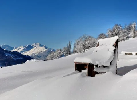 Bench covered with snow Stock Photos