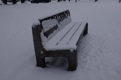 Bench covered in snow Stock Photos