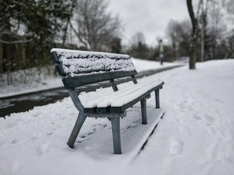 Bench covered with snow Foto stock